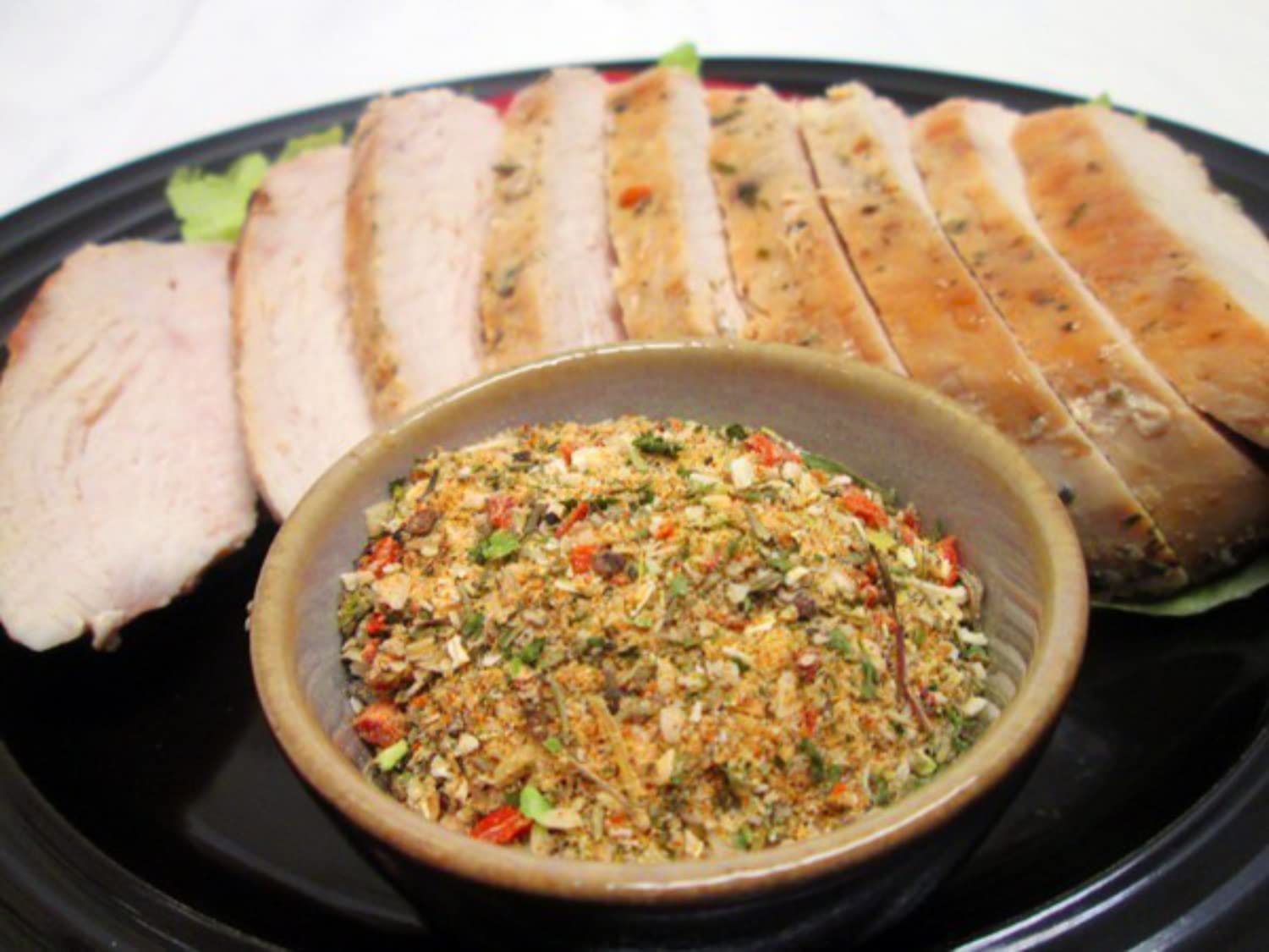 Mrs. Dash Original seasoning sprinkled on fish to boost flavor