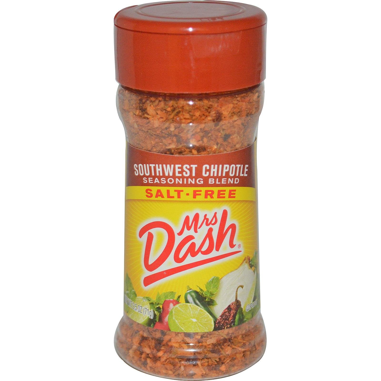 Mrs. Dash Southwest Chipotle seasoning bottle pours smoky flavor onto grilled chicken.