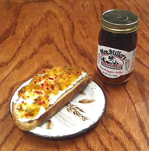 Mrs. Miller's pepper jelly on a cheese board pairs with crackers and cheeses