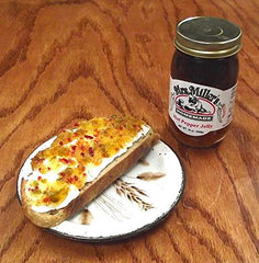 Mrs. Miller's pepper jelly on a cheese board pairs with crackers and cheeses