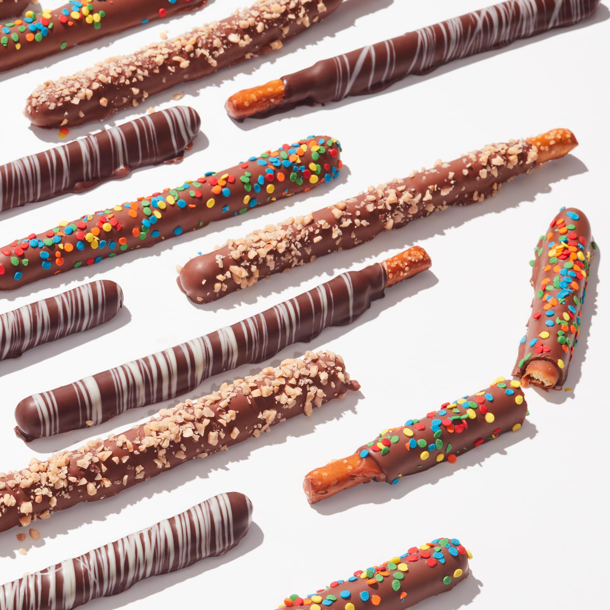 Mrs Prindables milk chocolate pretzel rod with rainbow sprinkles, playful treat
