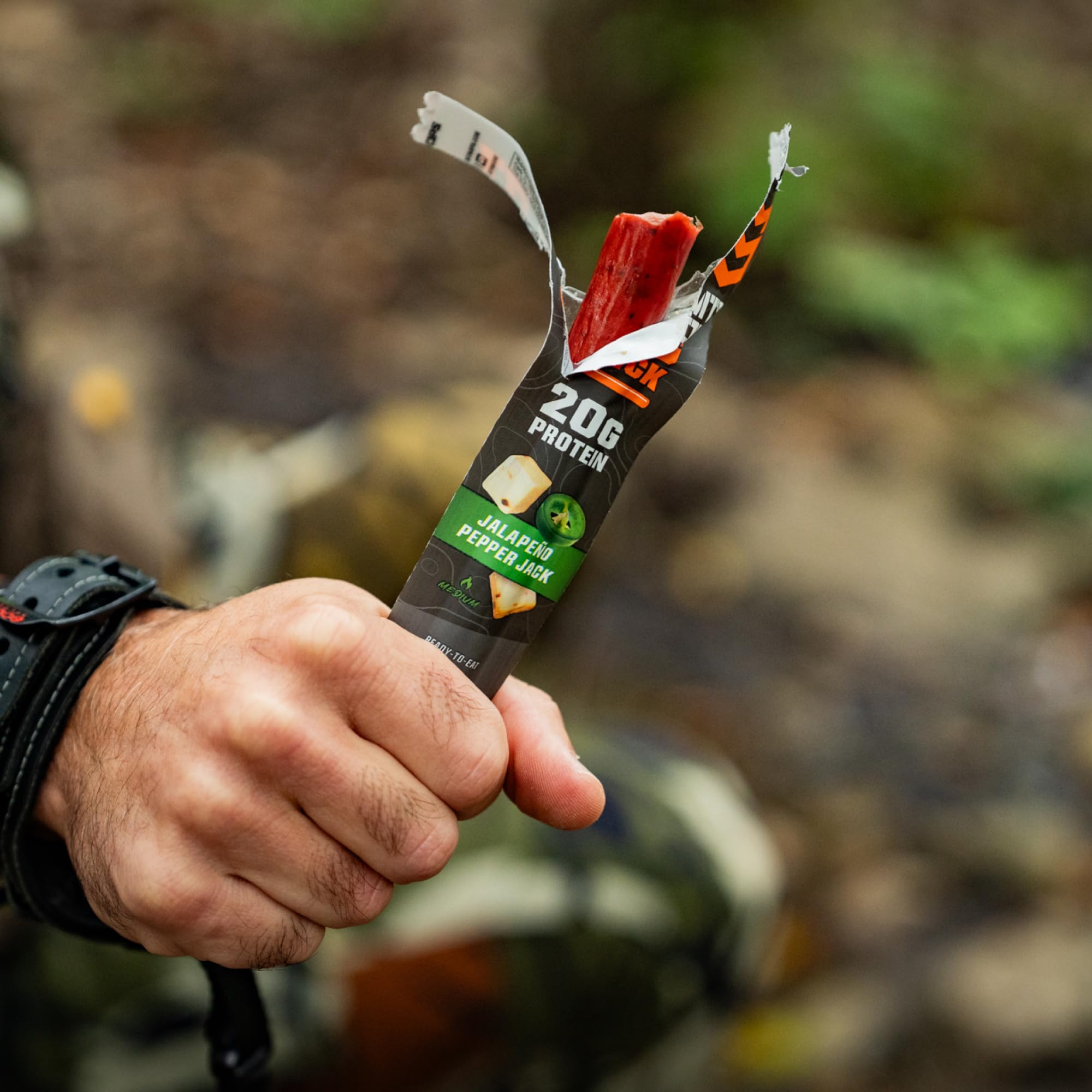 MTN OPS quick-draw snack next to backpack for on-the-go fueling