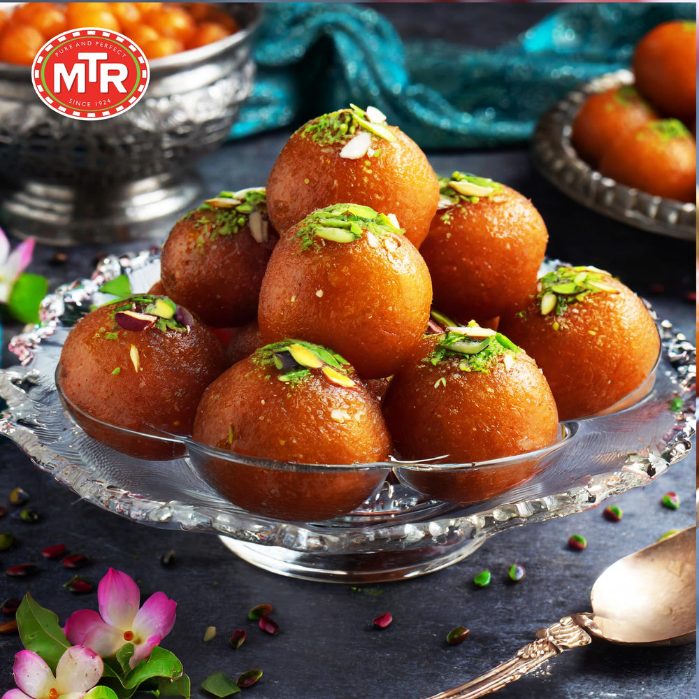 MTR Gulab Jamun on serving dish with rose syrup aroma