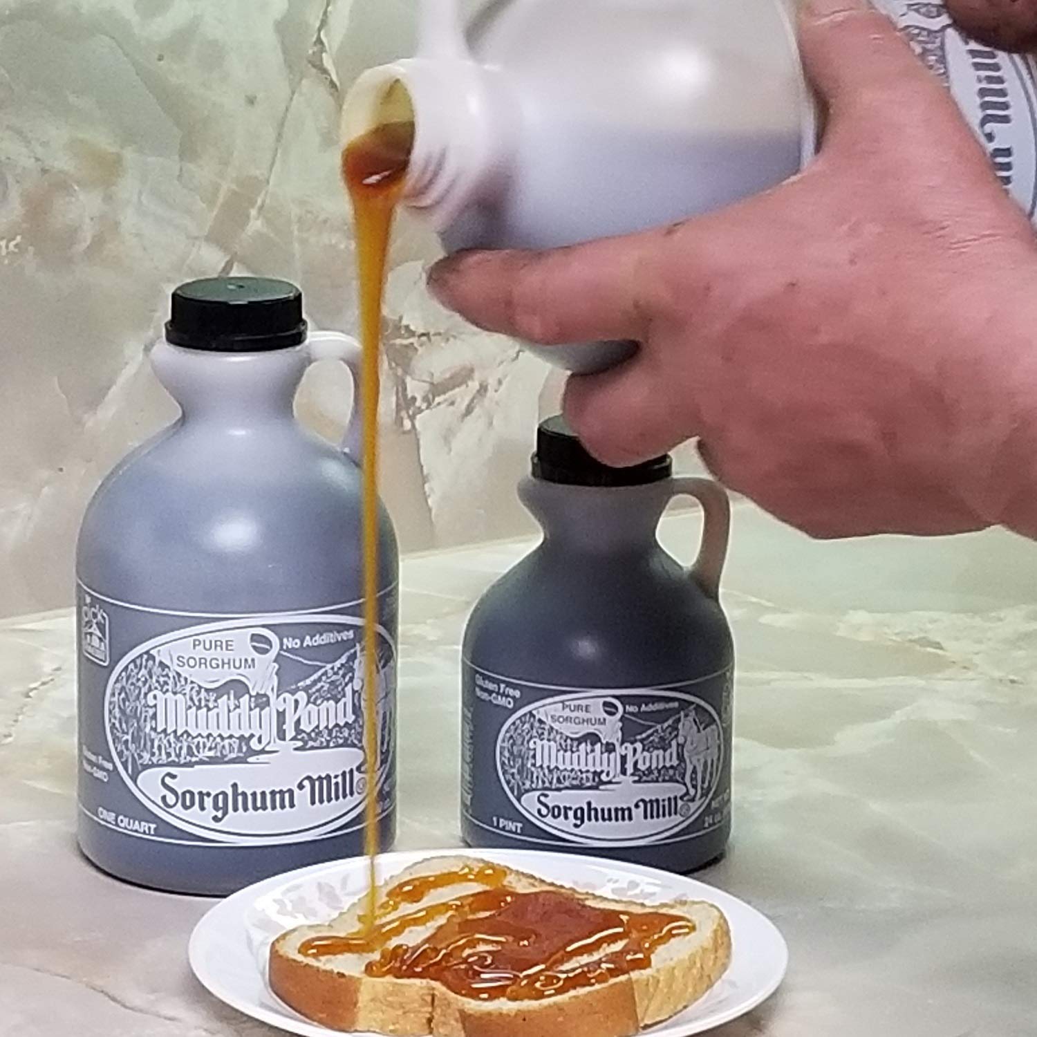 Muddy Pond Sorghum Mill evaporator pan boiling syrup with rich aroma for breakfast.