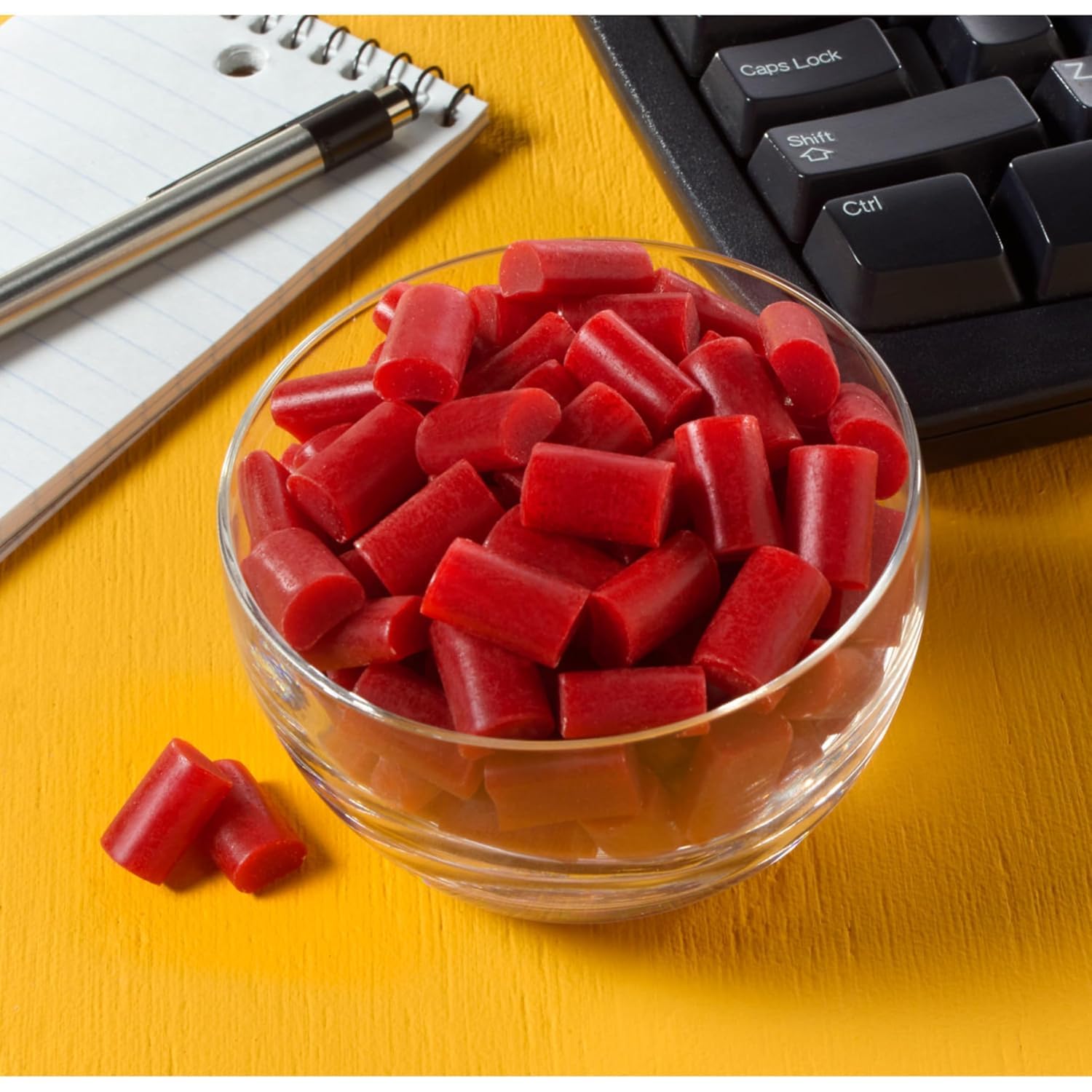 Snack time bowl filled with Munchique Licorice Nibz cherry bites.