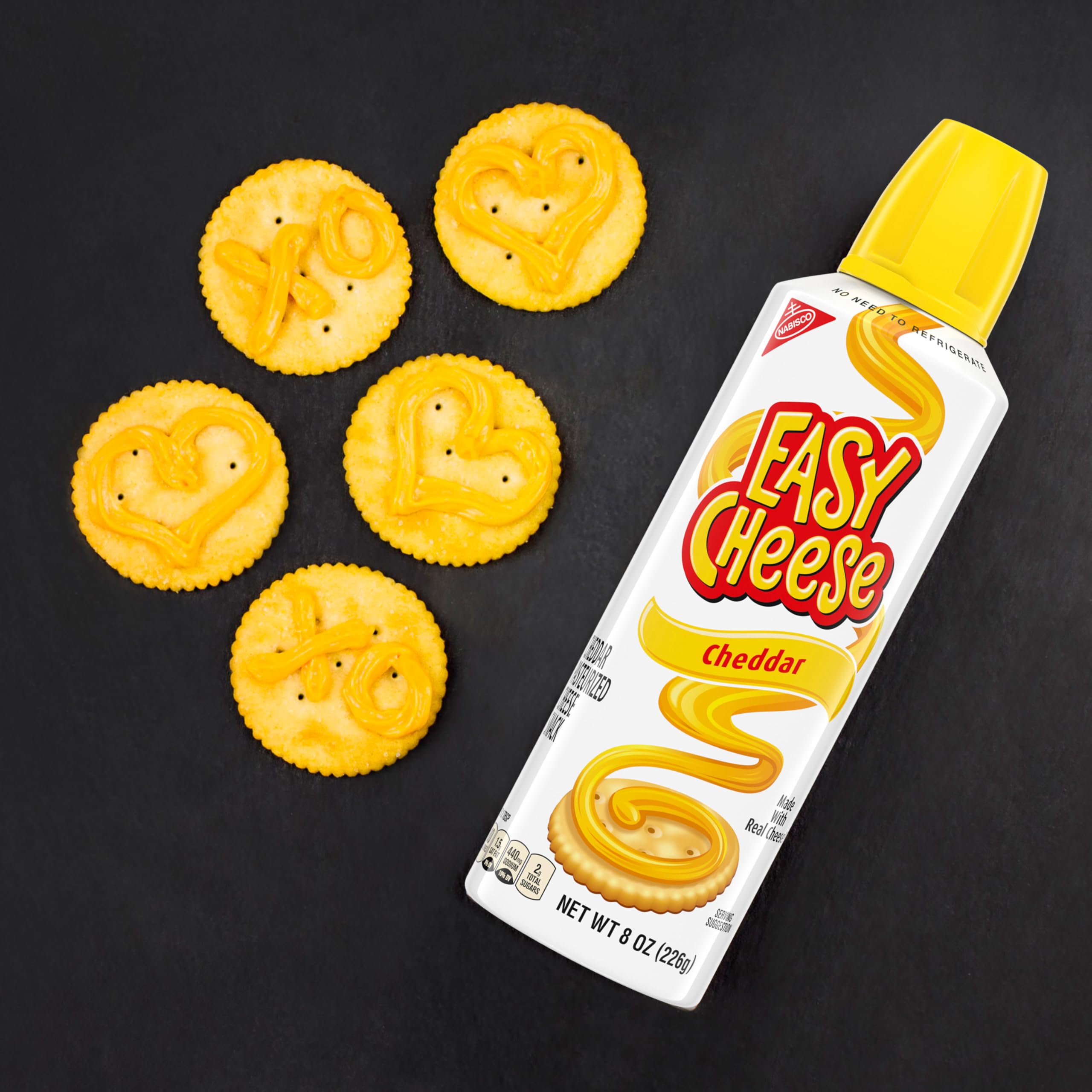 NABISCO Easy Cheese cheddar spray texture on a cracker.