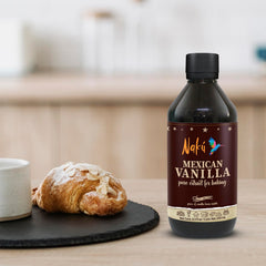 Naku Vanilla beans inside bottle highlighting premium ingredients for gourmet baking.