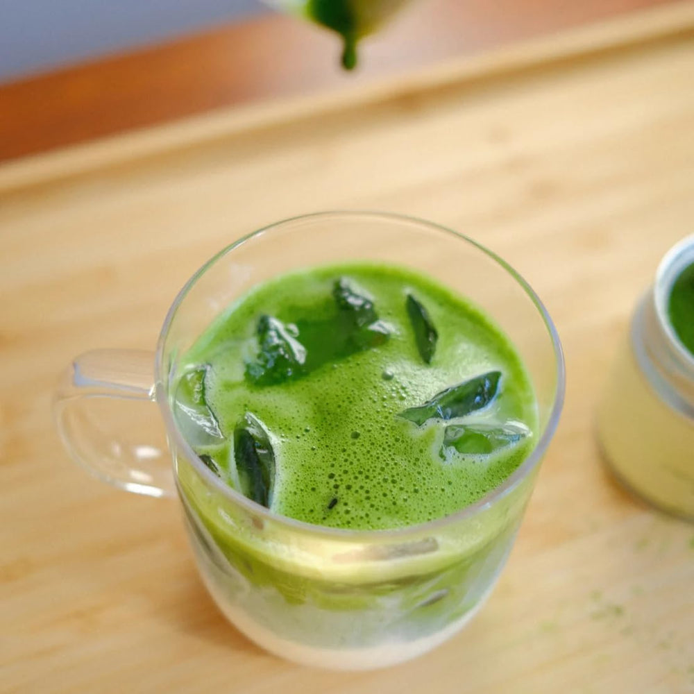 Nami Matcha Okumidori glass tea pour showcases smooth, vibrant matcha texture.