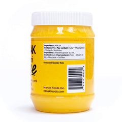 Nanak Desi Ghee in a sizzling pan shows high-heat cooking.