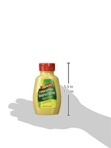 Nance's Mustard Sharp & Creamy spread on a cracker, ready to dip.