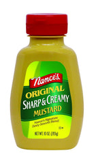 Nance's Mustard Sharp & Creamy bottle on kitchen counter, ideal for hot dogs and dips.