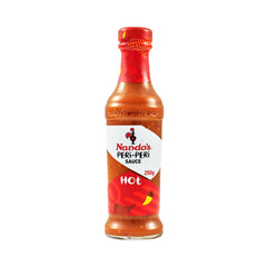 Nando's Hot Peri-Peri sauce bottle closeup showcasing fiery heat for marinades.