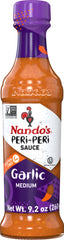 Nando's PERi PERi Garlic Sauce bottle adds bold flavor to grilled dishes.