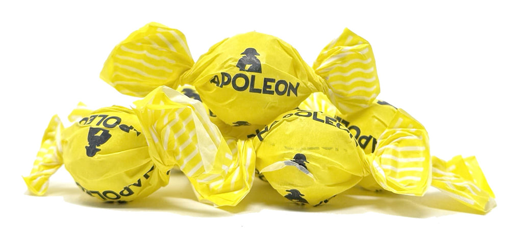 Napoleon Sour Lemon Balls surface texture, glossy hard candy exterior.