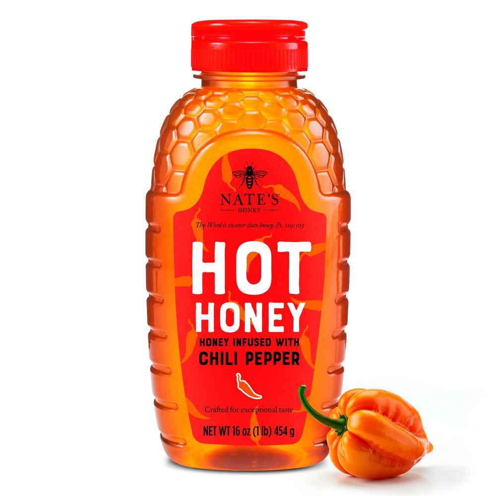 Nate's Hot Honey bottle pouring over toast for a sweet heat kick.