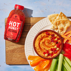 Nate's Hot Honey on pizza drizzle for a balanced sweet and spicy finish.