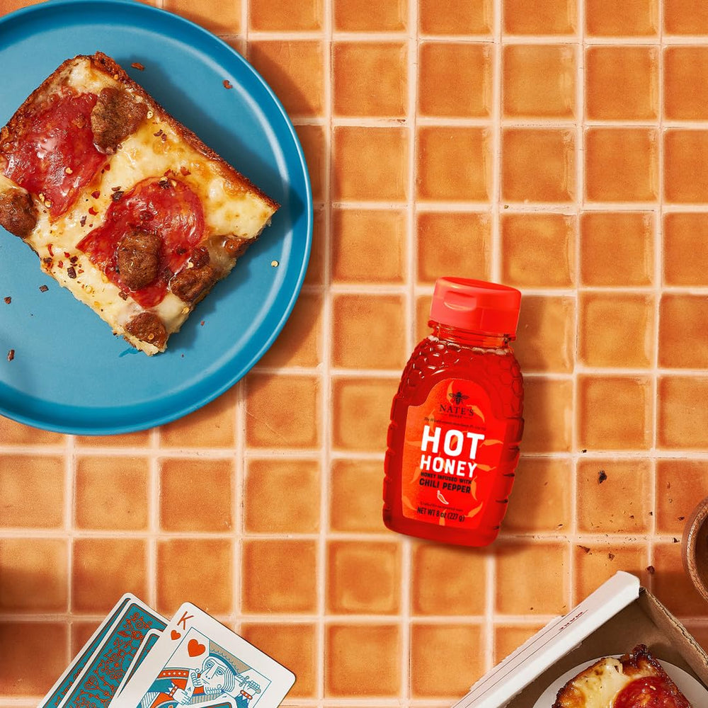 Nate's Hot Honey pizza topping drizzle adds bold, honey-kissed heat.