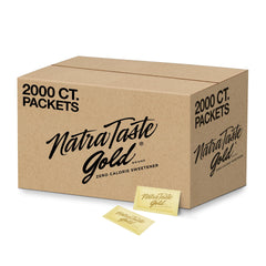 NatraTaste Gold zero calorie packets dissolving in hot coffee for sugar-free sweetness.