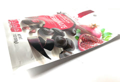 Natural Cravings Chocolate Covered Pomegranates closeup chocolate coating, rich texture.