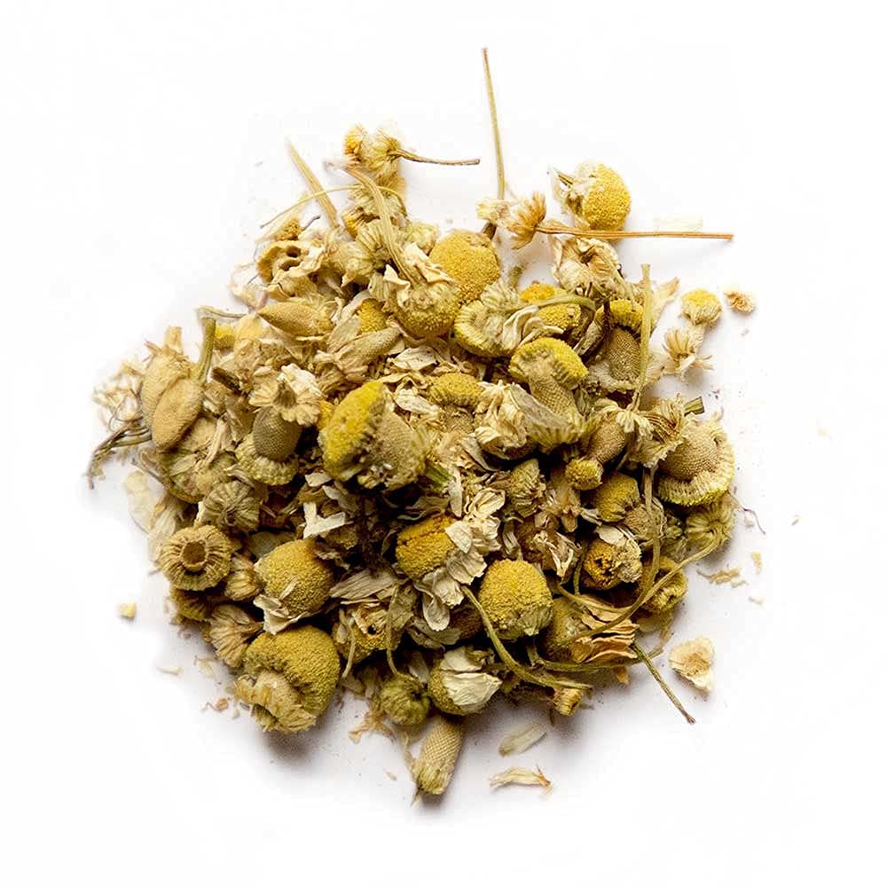 Nature Restore chamomile dried flowers – close-up of delicate blossoms ready for tea.