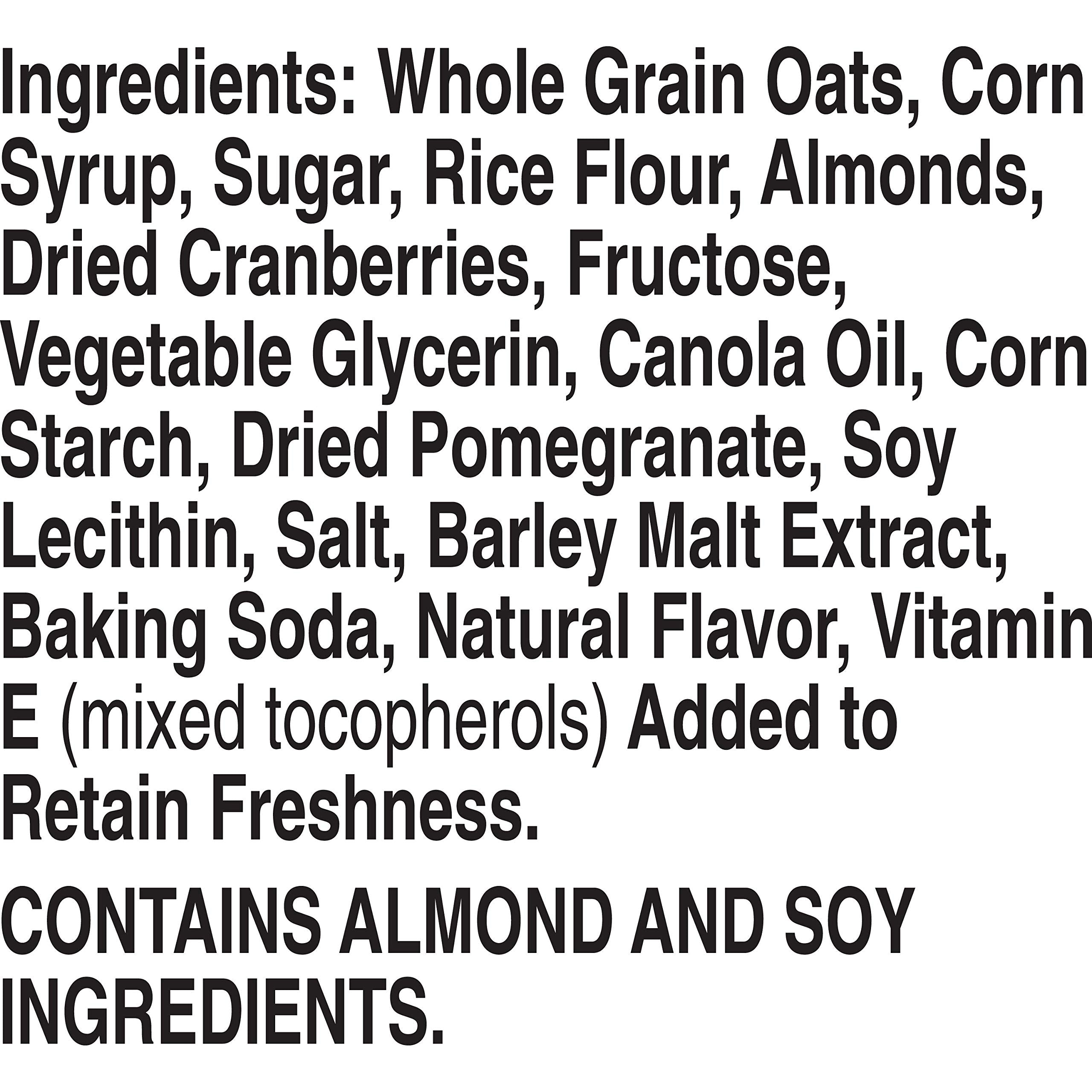 Nature Valley almonds-cranberries-pomegranate-bar close-up signals trail-ready fuel.