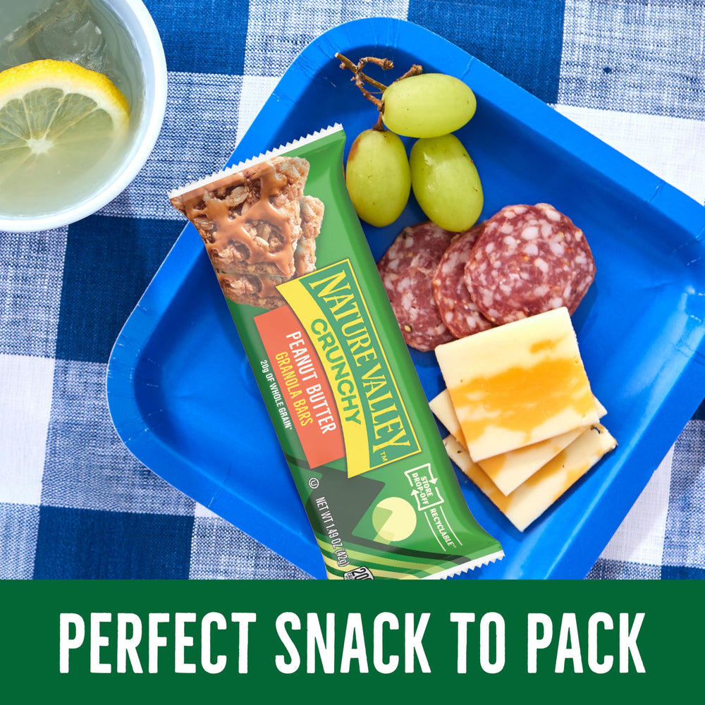 Family enjoying Nature Valley bars during a hike