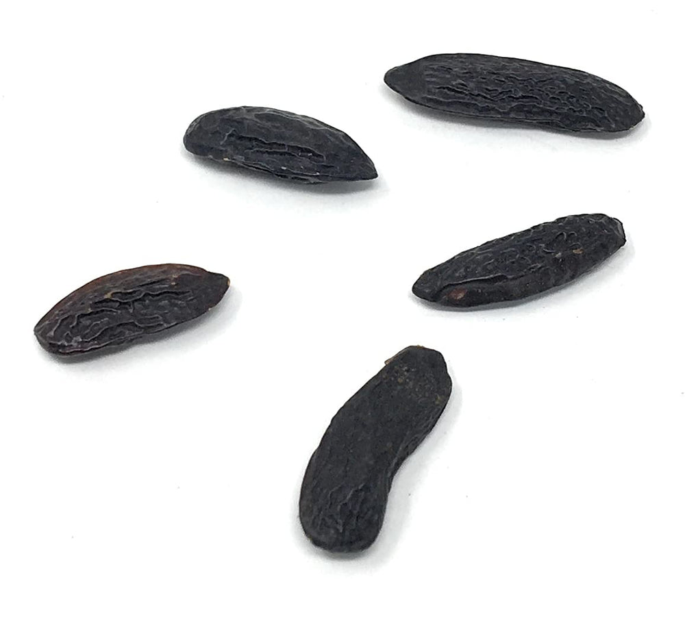 Naturegrail tonka beans in bowl demonstrate versatile flavoring for ice cream and baked goods.