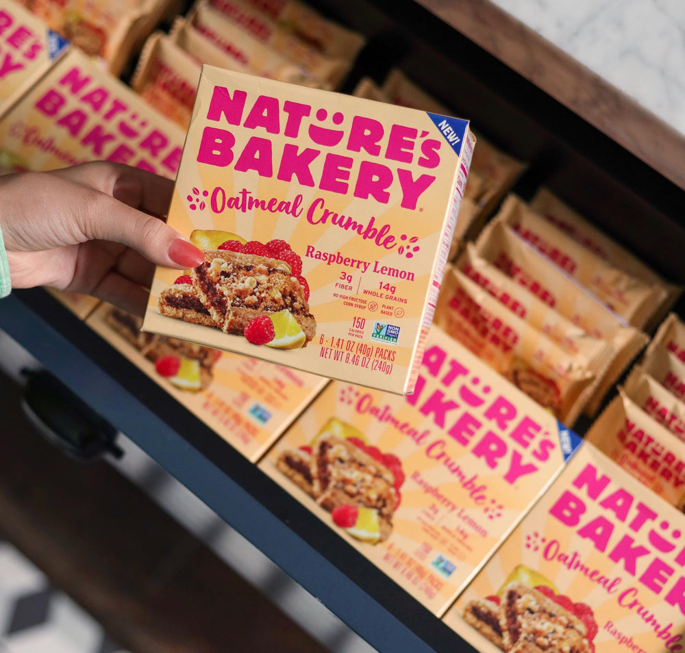 Nature's Bakery Raspberry Lemon Oatmeal Crumble Bars in a cozy kitchen scene