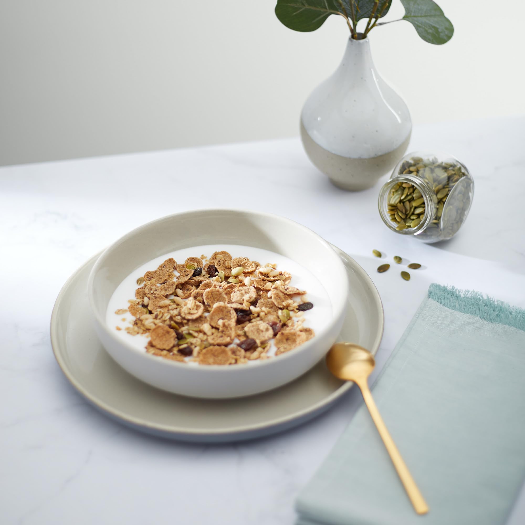 Nature's Path Flax Plus cereal in a bowl with milk illustrating stay-crunch crunchiness.