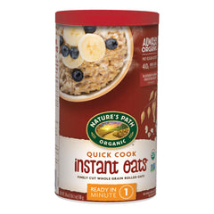 Nature's Path organic quick cook oatmeal canisters in a six-pack on the counter.