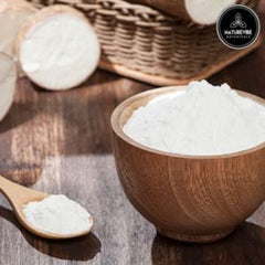 Naturevibe cassava flour pouring jar showing smooth texture for easy measuring.