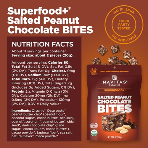 Navitas Bites Salted Peanut Chocolate closeup—creamy chocolate with crunchy peanuts.