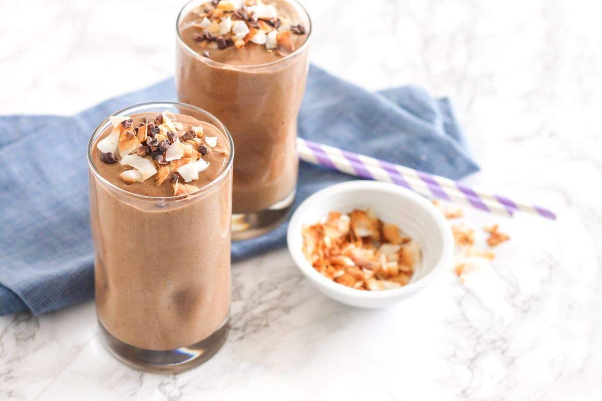 Dusting Navitas Organics cacao powder over desserts for a gourmet finish.