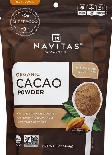 Pouring Navitas Organics cacao powder into a blender for smoothies.