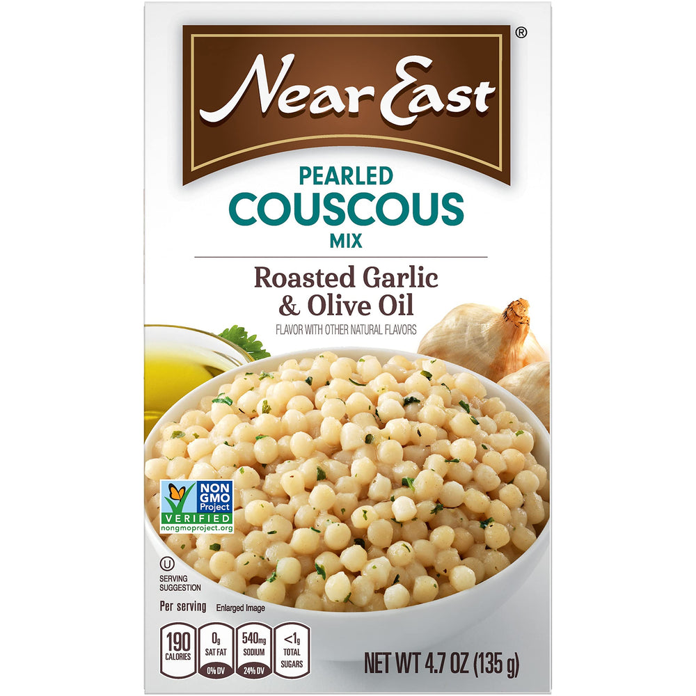 Near East pearled couscous fluffy bowl of cooked dish topped with garlic oil.