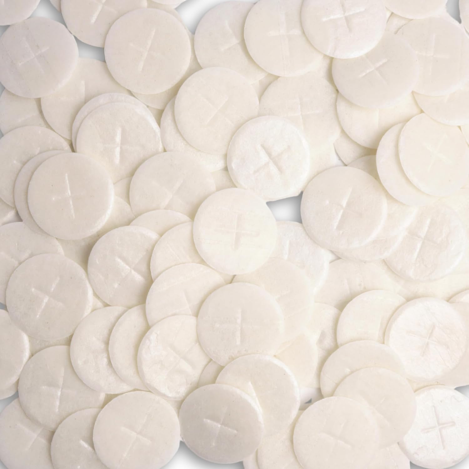 Needzo altar bread with white cross design, ideal for Eucharist rites.