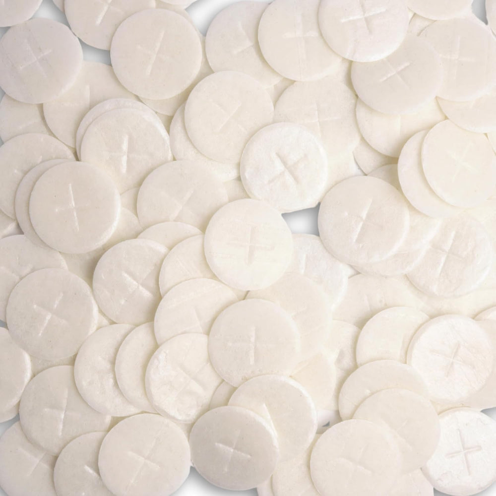 Needzo altar bread with white cross design, ideal for Eucharist rites.