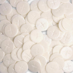 Needzo altar bread with white cross design, ideal for Eucharist rites.