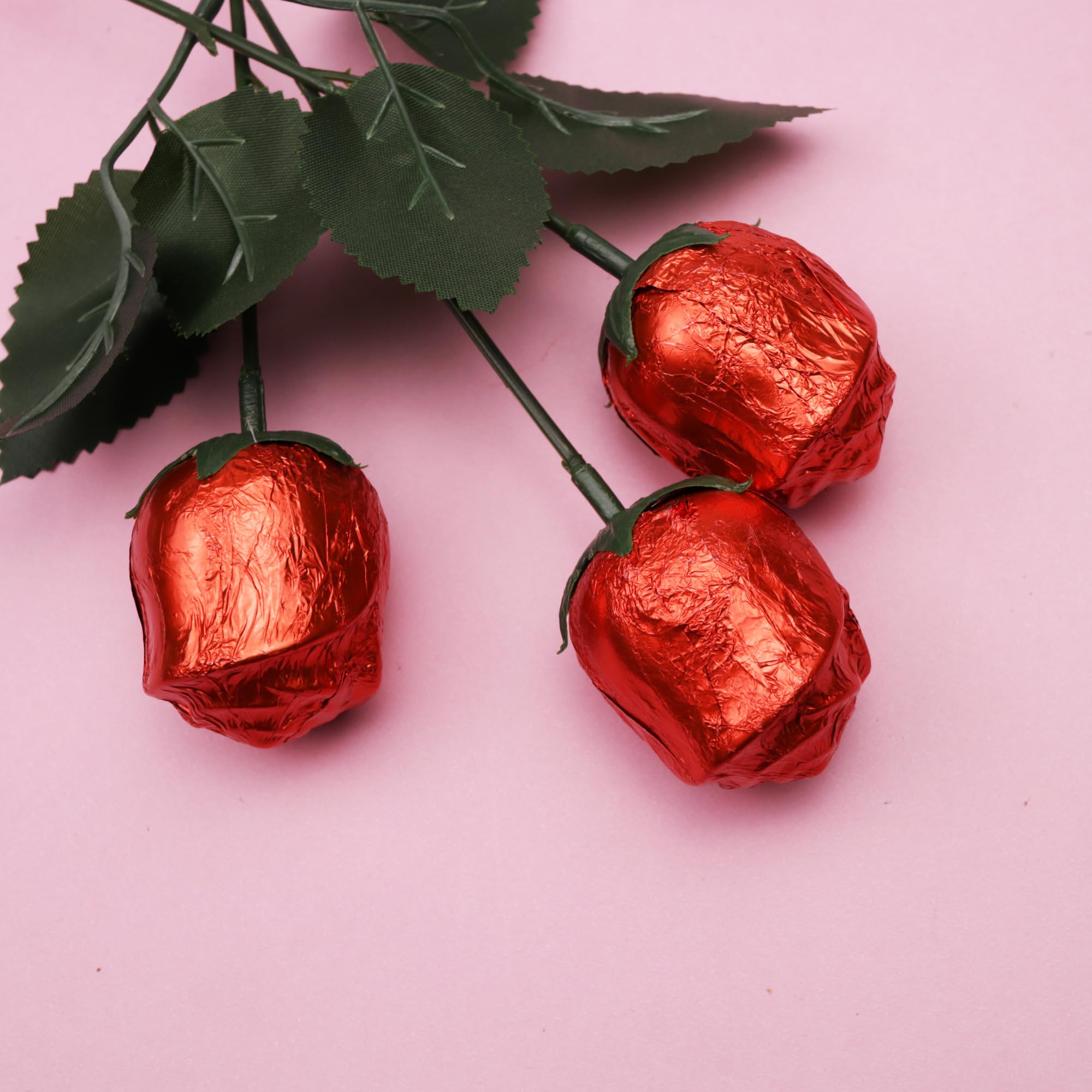 Needzo rose-shaped candy decorations detail for dessert presentation.