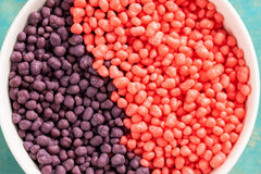 Nerds strawberry crystals close-up showing sweet color and crunchy bite