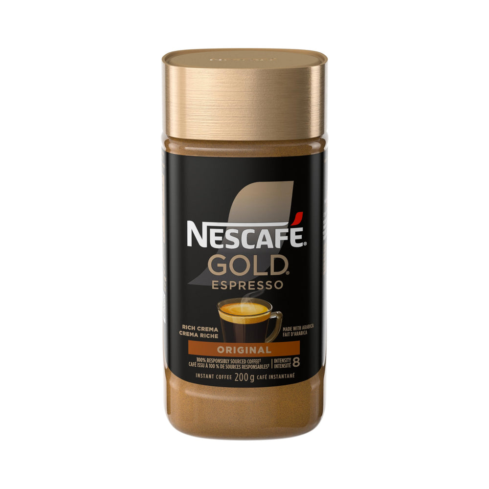 NESCAFE Gold Espresso Instant Coffee canister on a kitchen counter preserving freshness.