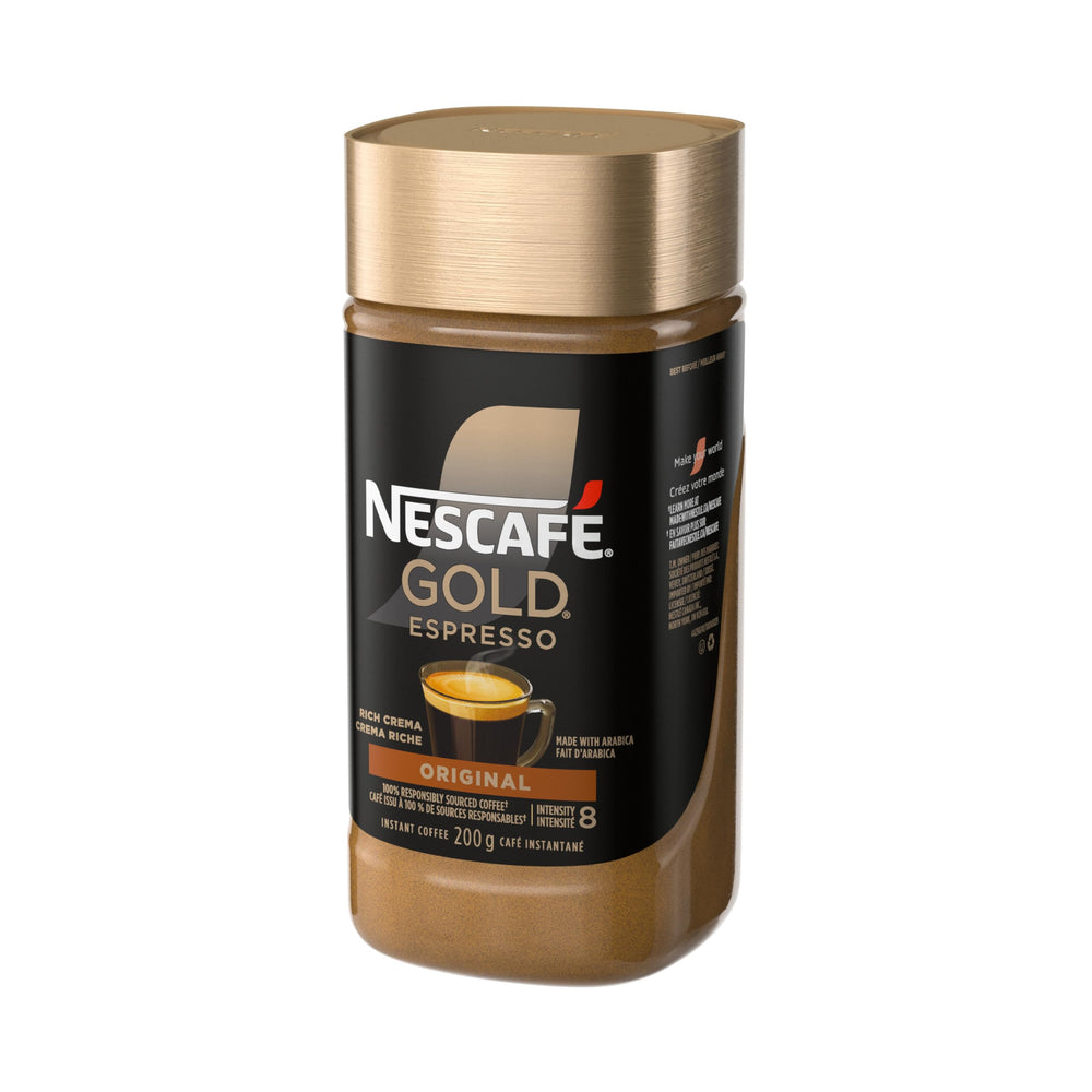 Pouring hot water over NESCAFE Gold Espresso Instant Coffee for a rich cup.