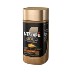Pouring hot water over NESCAFE Gold Espresso Instant Coffee for a rich cup.