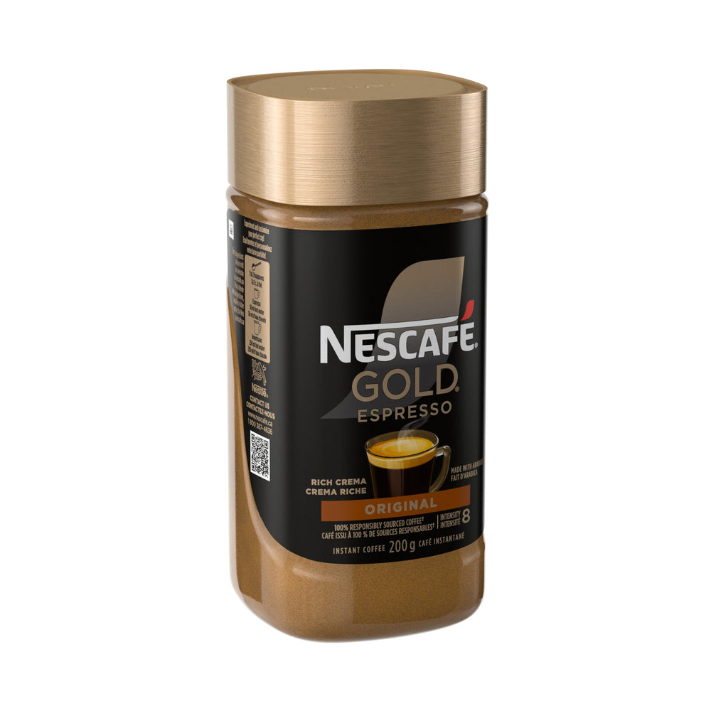 NESCAFE Gold Espresso Instant Coffee scoop beside the canister for quick brews.