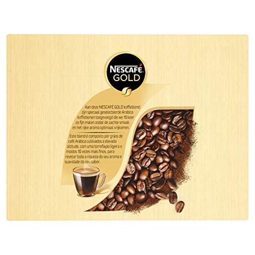 Nescafé Gold sticks being stirred in hot water for a smooth, satisfying cup.