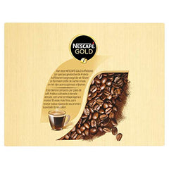 Nescafé Gold sticks being stirred in hot water for a smooth, satisfying cup.