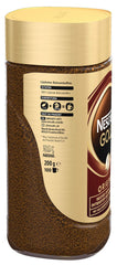 Nescafe Gold Original cup with steam suggesting a fast satisfying sip