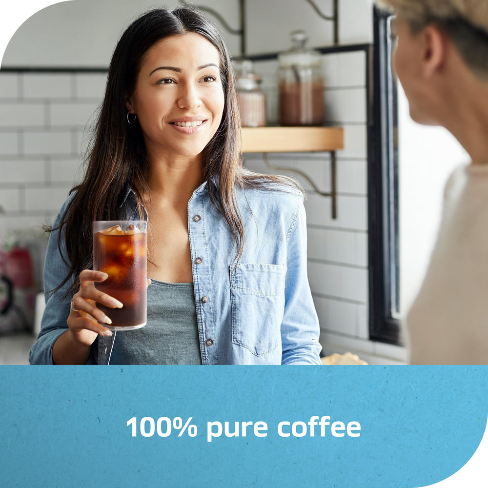 NESCAFÉ Ice Roast with milk in a glass for a creamy iced coffee.