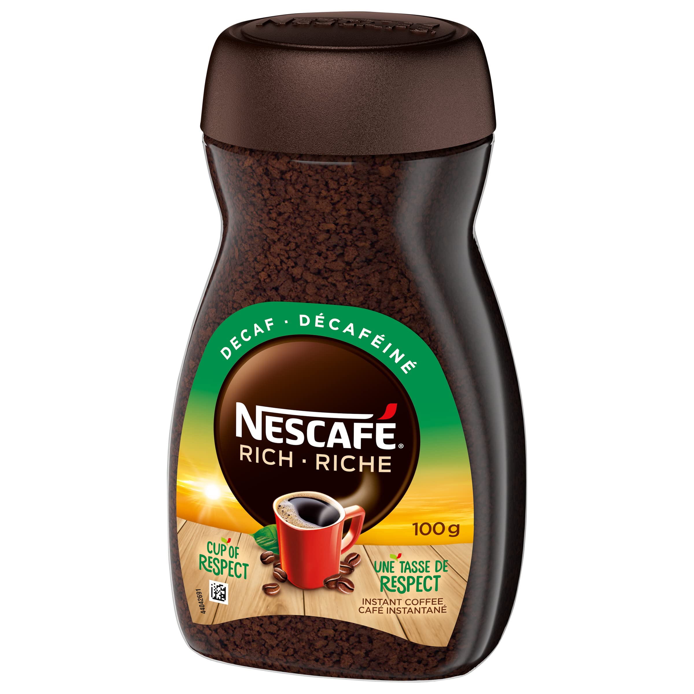 NESCAFÉ Rich Decaf coffee beans and texture ready for grinding.
