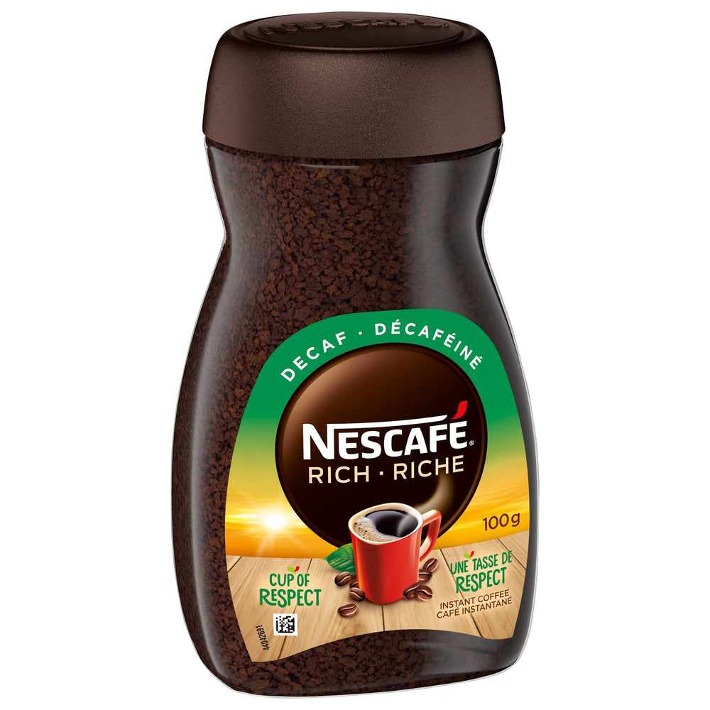 NESCAFÉ Rich Decaf being poured into hot water for a quick brew.